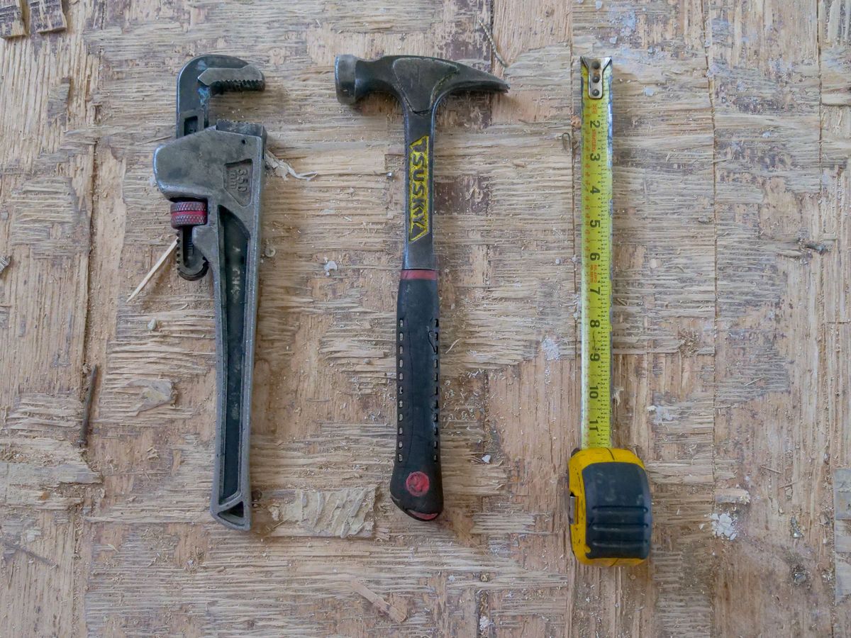 Plumbing tools on a timber bench